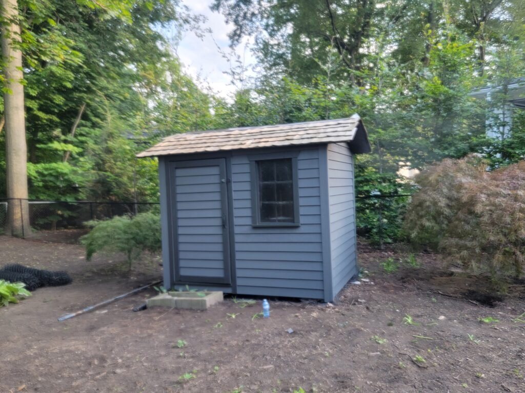 mini house wiht wood siding. done by soca services
