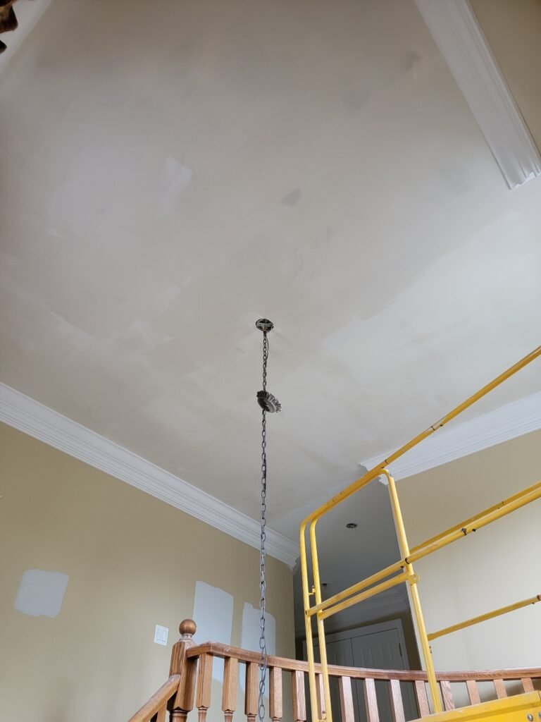 working in higth ceiling to remove popcorn ceiling