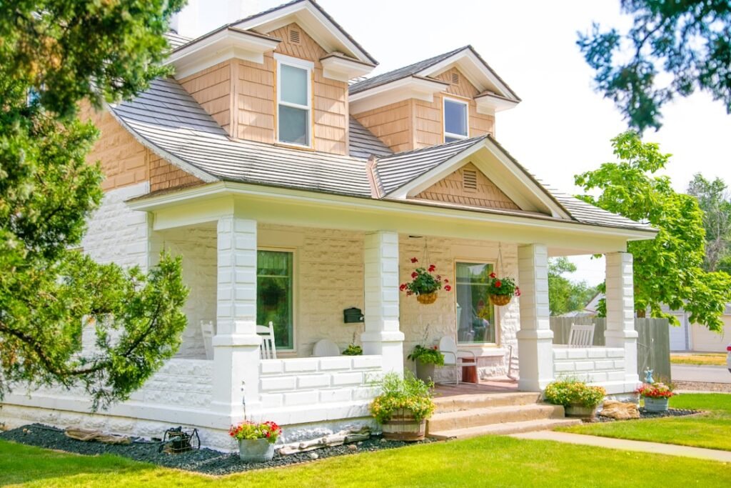 Beautiful exterior of a home showing professional painted siding, trim, and porch details