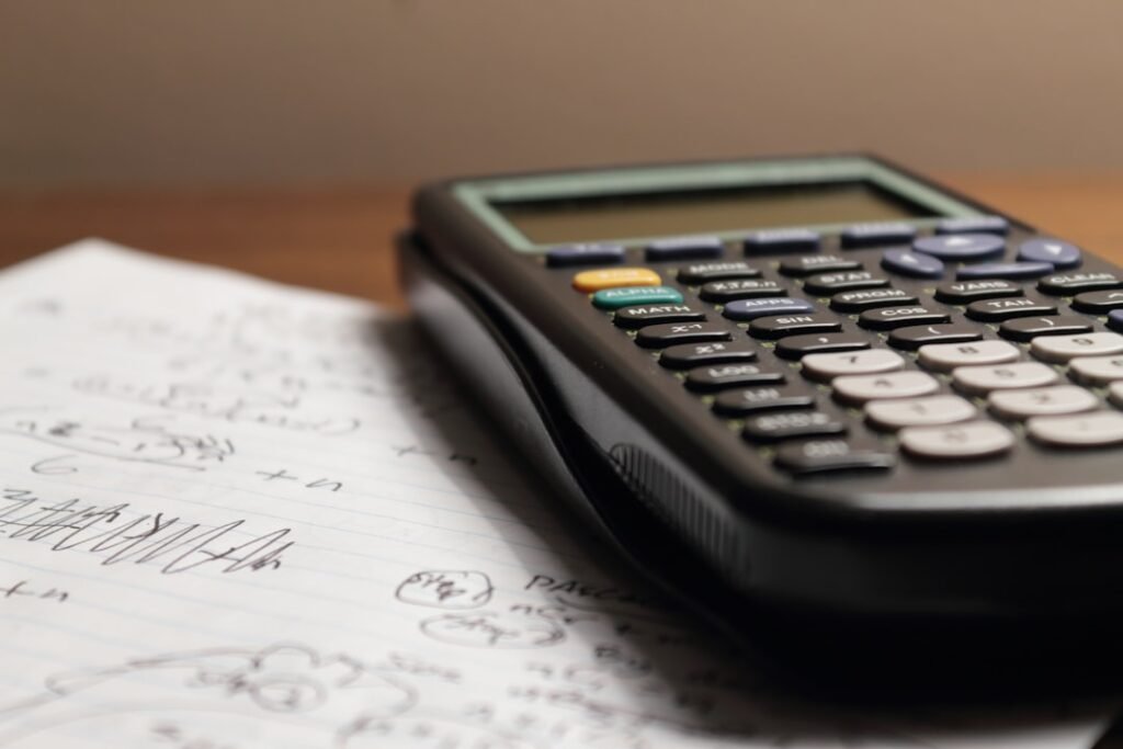 Calculator with handwritten notes for budgeting home renovation costs