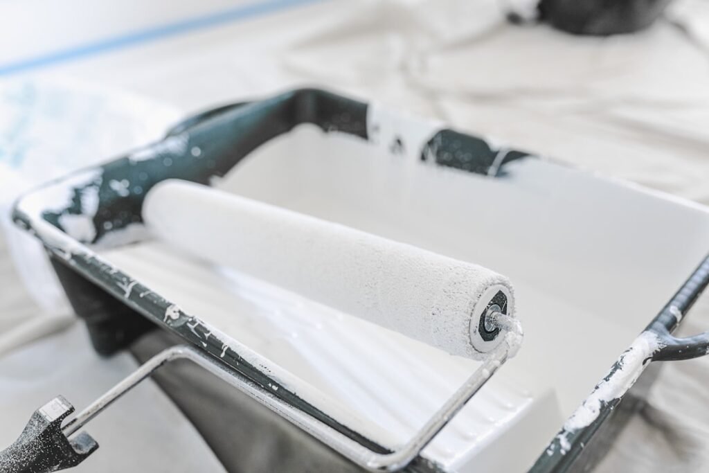Professional paint roller in paint tray showing quality tools and equipment used by Toronto painters