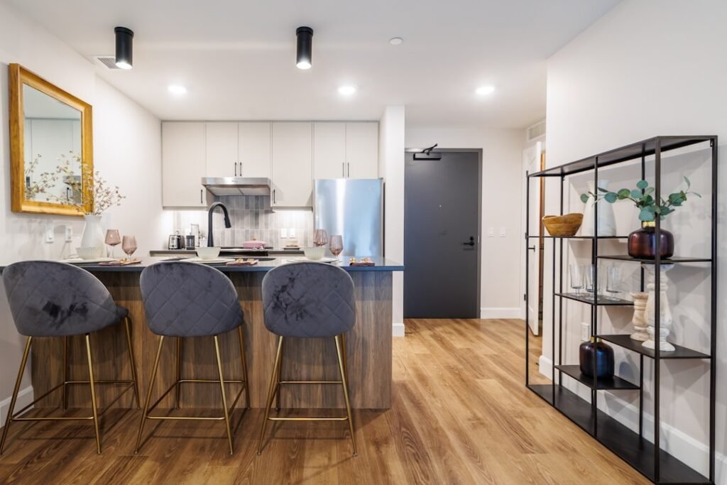 Modern condo kitchen interior with clean white walls and contemporary design